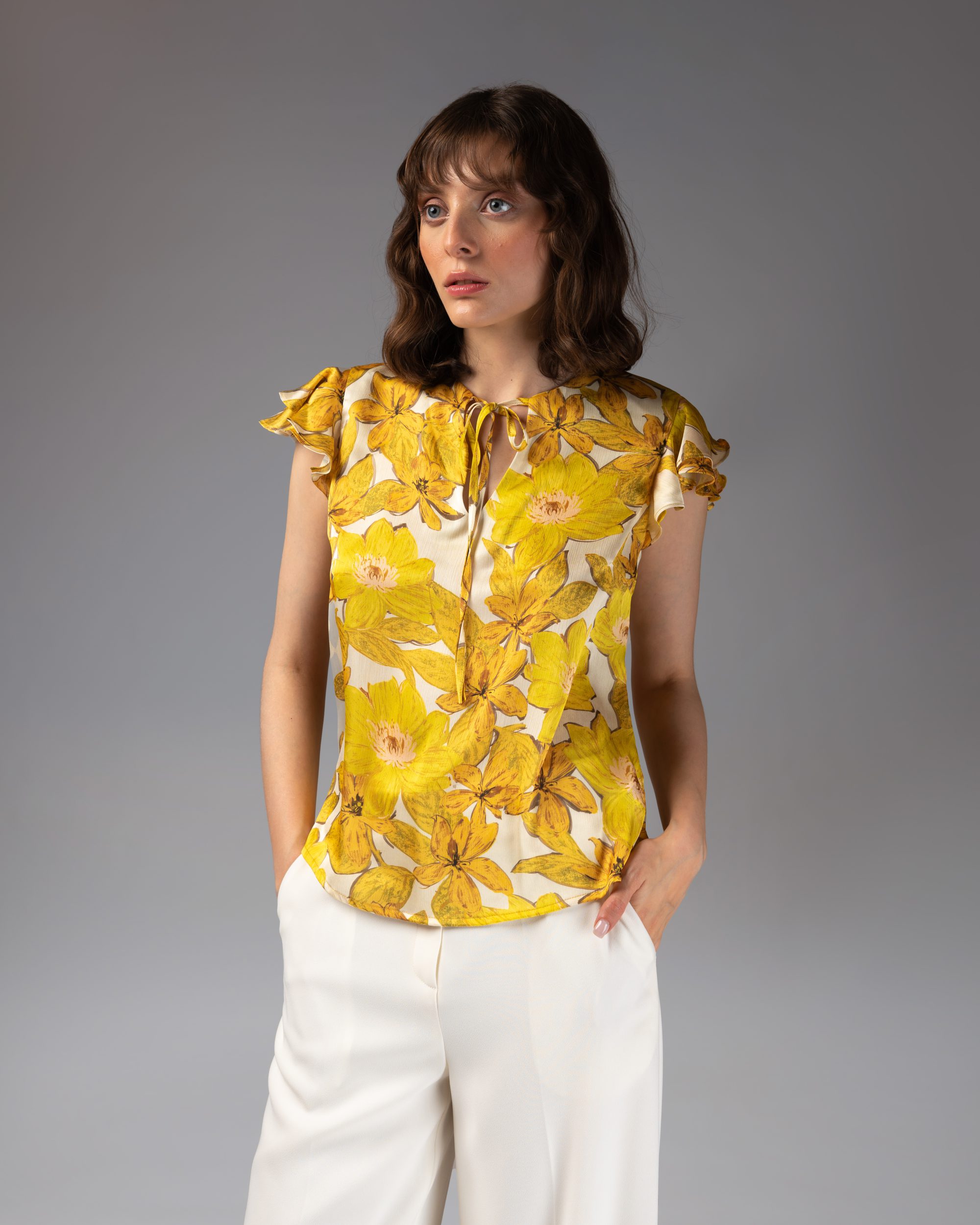 Front of Nevado Womens floral yellow/white cap-sleeved Blouse